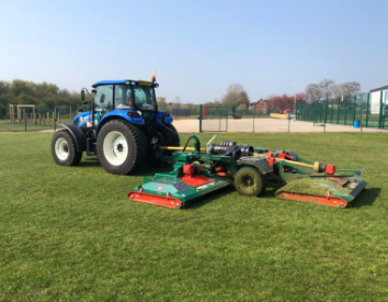 tractor mowing field